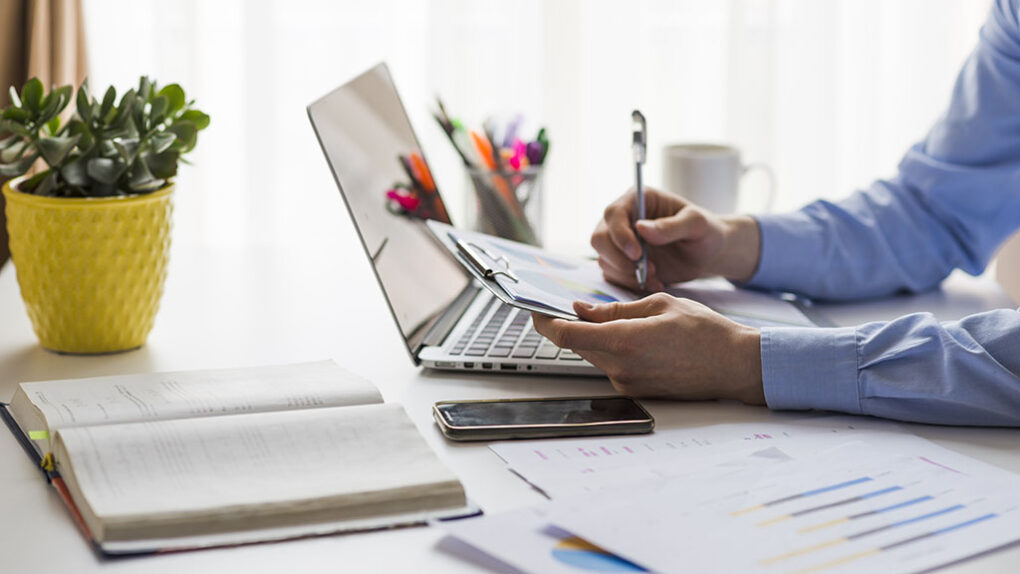 man-writing-documents-office.jpg